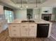 Kitchen island with double sink, perfect for entertaining at 689 Eagle Watch Rd, Oak Hill, FL 32759