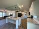 Modern kitchen with large island, marble countertops, and stainless steel appliances at 689 Eagle Watch Rd, Oak Hill, FL 32759