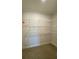 Ample walk-in closet with wire shelving at 689 Eagle Watch Rd, Oak Hill, FL 32759