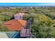 Aerial view of home and deck with ocean view at 69 S Turn Cir, Ponce Inlet, FL 32127