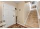 Entryway with tiled floor and staircase to the second floor at 5300 S Atlantic Ave # 15-601, New Smyrna Beach, FL 32169