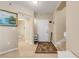 Bright entryway with tile flooring and access to stairs and bathroom at 5300 S Atlantic Ave # 15-601, New Smyrna Beach, FL 32169