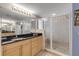 Bathroom with a large vanity, walk-in shower, and plenty of counter space at 5300 S Atlantic Ave # 15-601, New Smyrna Beach, FL 32169