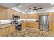 Updated kitchen featuring granite countertops and stainless steel appliances at 5300 S Atlantic Ave # 15-601, New Smyrna Beach, FL 32169