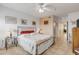 King bedroom with coastal decor and balcony access at 5300 S Atlantic Ave # 15-601, New Smyrna Beach, FL 32169
