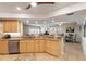 Open kitchen with granite island, breakfast bar, and views to living area at 5300 S Atlantic Ave # 15-601, New Smyrna Beach, FL 32169