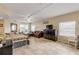 Bright living room with comfortable seating and large windows at 5300 S Atlantic Ave # 15-601, New Smyrna Beach, FL 32169