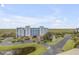 Aerial view of the building and surrounding landscape at 5300 S Atlantic Ave # 15-601, New Smyrna Beach, FL 32169