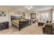 Spacious Primary bedroom with king-size bed and access to a private balcony at 5300 S Atlantic Ave # 15-601, New Smyrna Beach, FL 32169