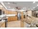 Spacious kitchen with granite countertops and stainless steel appliances at 5300 S Atlantic Ave # 15-601, New Smyrna Beach, FL 32169