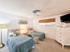 Guest bedroom with two twin beds and ample closet space at 3606 S Peninsula Dr # 614, Port Orange, FL 32127