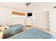 Guest bedroom with two twin beds and built-in shelving at 3606 S Peninsula Dr # 614, Port Orange, FL 32127