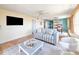 Living room with a view of the dining area and access to the kitchen at 3606 S Peninsula Dr # 614, Port Orange, FL 32127