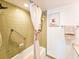 Clean bathroom featuring a shower/tub, and linen storage at 3606 S Peninsula Dr # 614, Port Orange, FL 32127