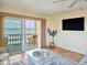 Living room with balcony access and stunning water views at 3606 S Peninsula Dr # 614, Port Orange, FL 32127