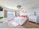 Main bedroom with water views, comfy bed, and white dresser at 3606 S Peninsula Dr # 614, Port Orange, FL 32127