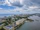An aerial view showcasing a waterfront condo building and pool at 3606 S Peninsula Dr # 614, Port Orange, FL 32127