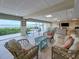 Common area with water views and comfortable seating at 3606 S Peninsula Dr # 614, Port Orange, FL 32127