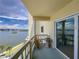 Relaxing balcony with partial water view and sliding door access at 3606 S Peninsula Dr # 614, Port Orange, FL 32127