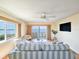 Bright living room with water views, comfy seating, and a large TV at 3606 S Peninsula Dr # 614, Port Orange, FL 32127