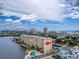 Condo building's aerial view highlighting its waterfront position and pool at 3606 S Peninsula Dr # 614, Port Orange, FL 32127