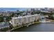 An aerial view of a condo building by the water with a pool at 3606 S Peninsula Dr # 614, Port Orange, FL 32127