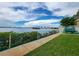 Peaceful waterfront walkway with kayak storage and lush grass at 3606 S Peninsula Dr # 614, Port Orange, FL 32127