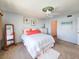 Bright bedroom with a comfortable bed and a full-size dresser at 3606 S Peninsula Dr # 614, Port Orange, FL 32127