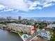 Aerial view of a condo building with a pool, near the water at 3606 S Peninsula Dr # 614, Port Orange, FL 32127