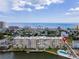 Aerial photo of condo building showcasing waterfront location and pool at 3606 S Peninsula Dr # 614, Port Orange, FL 32127