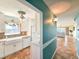 Bright kitchen features white cabinets, granite counters, and a farmhouse sink at 3606 S Peninsula Dr # 614, Port Orange, FL 32127