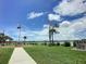 Relaxing waterfront park with a flag and walking path at 113 Neptune Dr, Edgewater, FL 32132