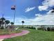 Scenic waterfront park with a pier, walking path, and lush landscaping at 113 Neptune Dr, Edgewater, FL 32132