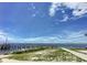 Community fishing pier extending over the calm waters at 113 Neptune Dr, Edgewater, FL 32132