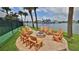 Relaxing fire pit area with wooden chairs near waterfront at 501 N Causeway # 2050, New Smyrna Beach, FL 32169