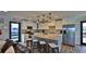 Modern kitchen with island, stainless steel appliances, and granite countertops at 501 N Causeway # 2050, New Smyrna Beach, FL 32169
