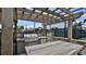 Outdoor kitchen with grill and pergola near tennis court at 501 N Causeway # 2050, New Smyrna Beach, FL 32169