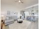 Open living room with grey sectional sofa and adjacent kitchen at 456 Lime Ave, Daytona Beach, FL 32124