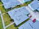 Aerial view of a pastel house with gray roof and a golf cart in the parking lot at 456 Lime Ave, Daytona Beach, FL 32124