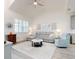 Open living area with sectional sofa, accent chair, and decorative wall art at 456 Lime Ave, Daytona Beach, FL 32124