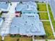 An aerial view showcasing a house's gray roof and pink exterior at 456 Lime Ave, Daytona Beach, FL 32124