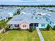 Aerial view of a charming two-story home with a unique exterior color scheme, surrounded by other houses at 456 Lime Ave, Daytona Beach, FL 32124