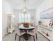 Dining area with round table and white cabinetry at 456 Lime Ave, Daytona Beach, FL 32124
