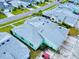 Aerial view of a pastel-colored house with gray roof and a golf cart at 456 Lime Ave, Daytona Beach, FL 32124