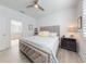 Spacious bedroom with king bed, ensuite bath access, and updated flooring at 456 Lime Ave, Daytona Beach, FL 32124