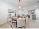 Bright dining room features a round table with four chairs and a modern light fixture at 456 Lime Ave, Daytona Beach, FL 32124
