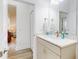 Guest bathroom with vanity, quartz countertop, and linen storage at 456 Lime Ave, Daytona Beach, FL 32124