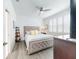 Spacious bedroom with king-size bed, wood floors, and plenty of natural light at 456 Lime Ave, Daytona Beach, FL 32124