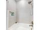 Updated shower with neutral tile and built-in shelving at 456 Lime Ave, Daytona Beach, FL 32124