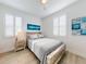 Bedroom with coastal decor and a rustic wood bed frame at 456 Lime Ave, Daytona Beach, FL 32124
